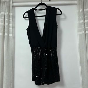 BEBE ROMPER. v cut neck line with tie in the back. Sequin short.